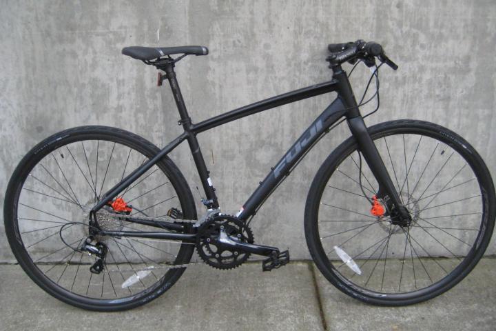 a bicycle parked on the side of a building