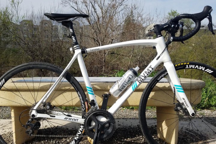 a bicycle parked on the side of the road