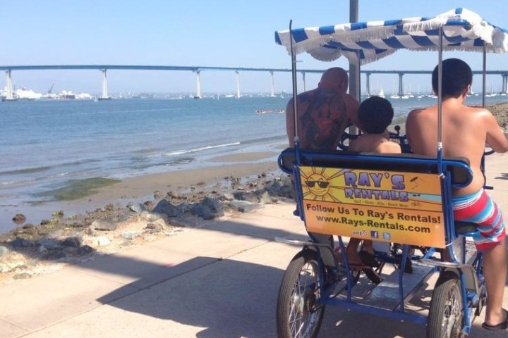 a man riding a motorcycle on a beach