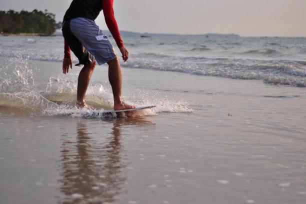 a man riding a wave on a surfboard in the water