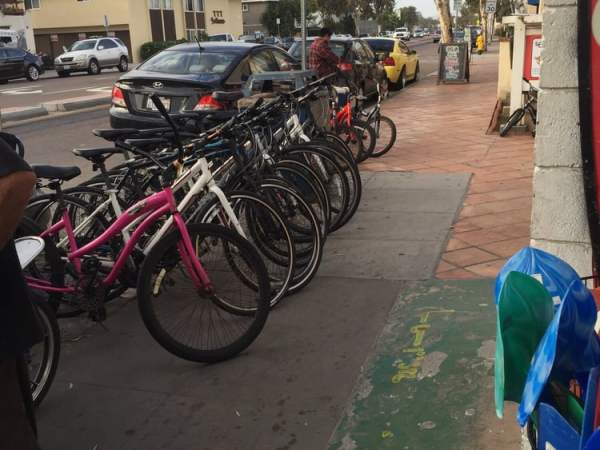 a bicycle parked on the side of the street