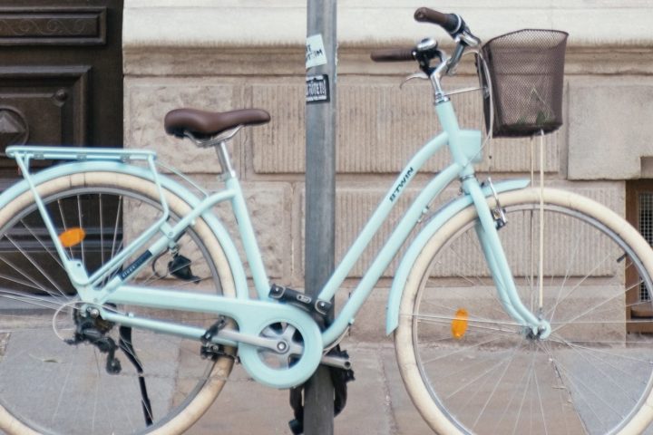 a bicycle parked on the side of a building